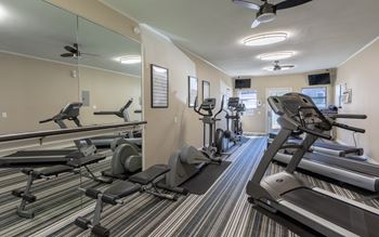 a fitness center with cardio equipment  at Canyon Creek, Austin, TX, 78759